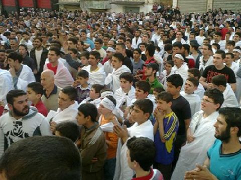 מפגינים בעיר חומס [צילום: AP]