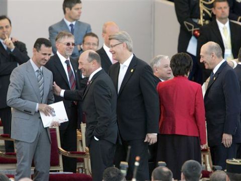 במרחק נגיעה, אסד ואולמרט [צילום: AP]