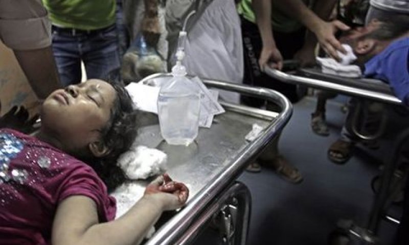 פצועים פלשתינים בבית חולים שיפא בעזה [צילום: AP]