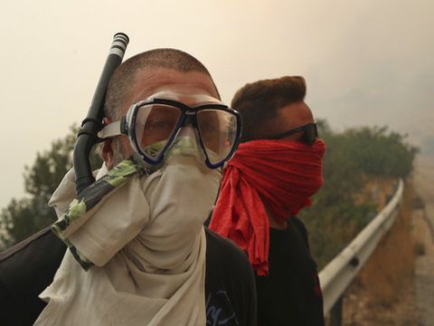 [צילום: טאנסיס סטאבארקיס/AP]